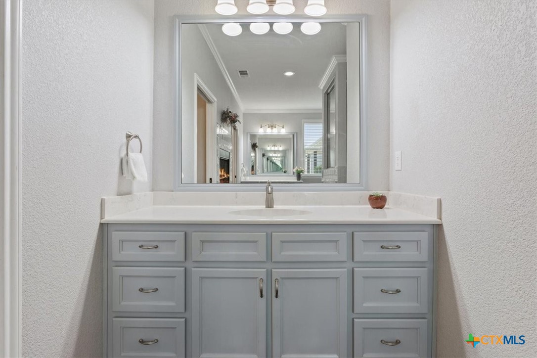 645 West Big Elm Road Troy, TX 76579 - Photo 17 of 37 a bathroom with a sink and a mirror