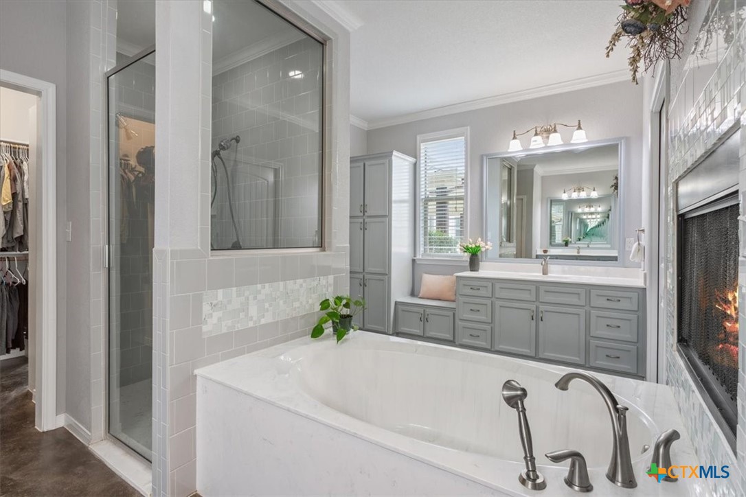 645 West Big Elm Road Troy, TX 76579 - Photo 18 of 37 a bathroom with a tub sink and mirror