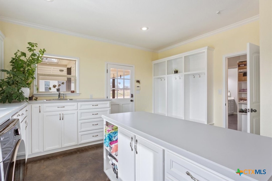 645 West Big Elm Road Troy, TX 76579 - Photo 21 of 39 a kitchen that has a lot of white cabinets and wooden floor