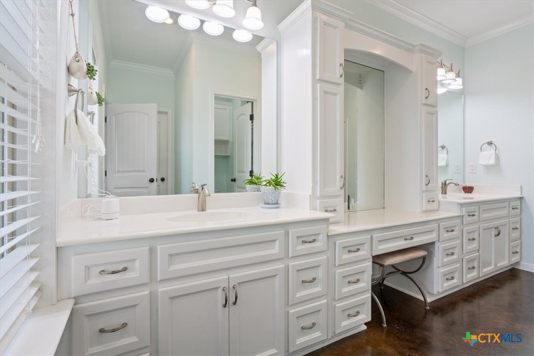 645 West Big Elm Road Troy, TX 76579 - Photo 22 of 37 a bathroom with a sink vanity granite tub and a mirror