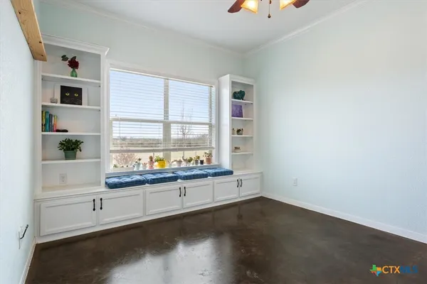 a room with a desk and a window