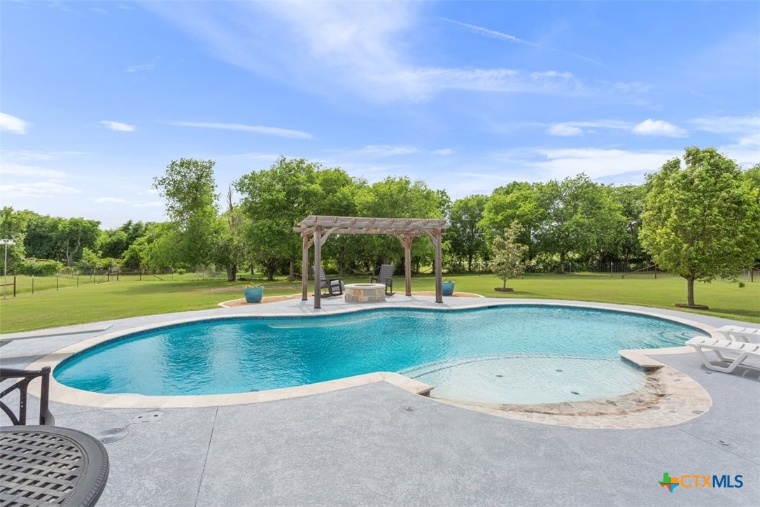 645 West Big Elm Road Troy, TX 76579 - Photo 30 of 39 a view of a swimming pool and a yard