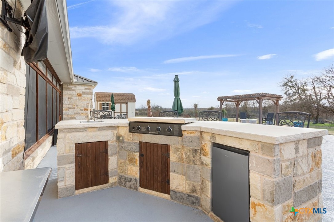 645 West Big Elm Road Troy, TX 76579 - Photo 30 of 37 a view of open kitchen with a sink and dishwasher a stove top oven