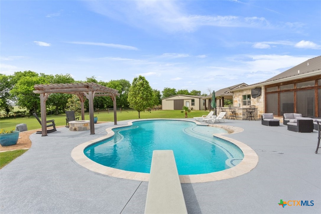 645 West Big Elm Road Troy, TX 76579 - Photo 31 of 39 a view of a swimming pool with a patio