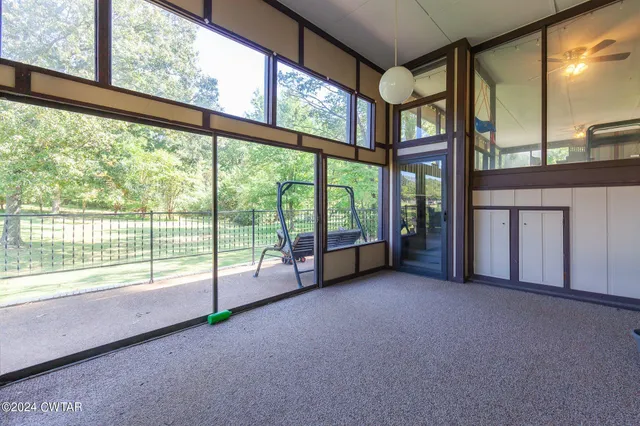 a view of an empty room with windows