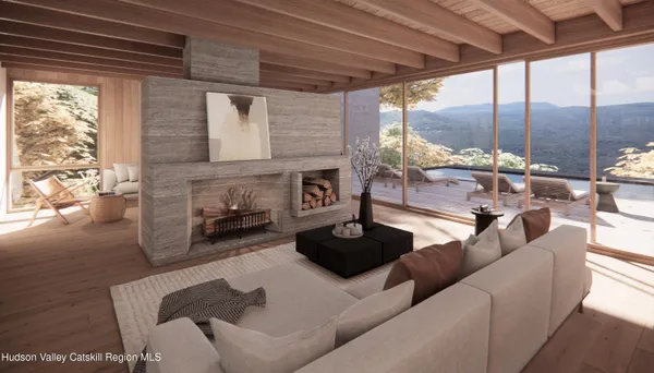 a living room with furniture a fireplace and a table