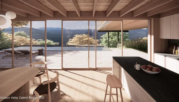 a living room with a large window and a table