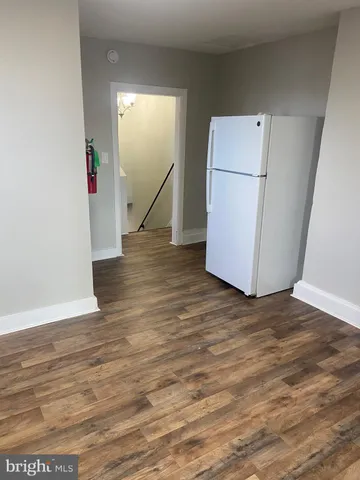 a view of a livingroom with wooden floor