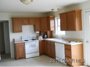 243 St James Road Fishersville, VA 22939 - Photo 5 of 5 a kitchen with a sink a stove and cabinets