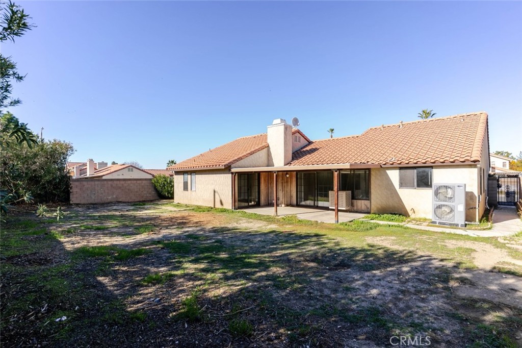 4906 Pacifica Avenue Palmdale, CA 93552 - Photo 27 of 36 a big house with yard in front of it