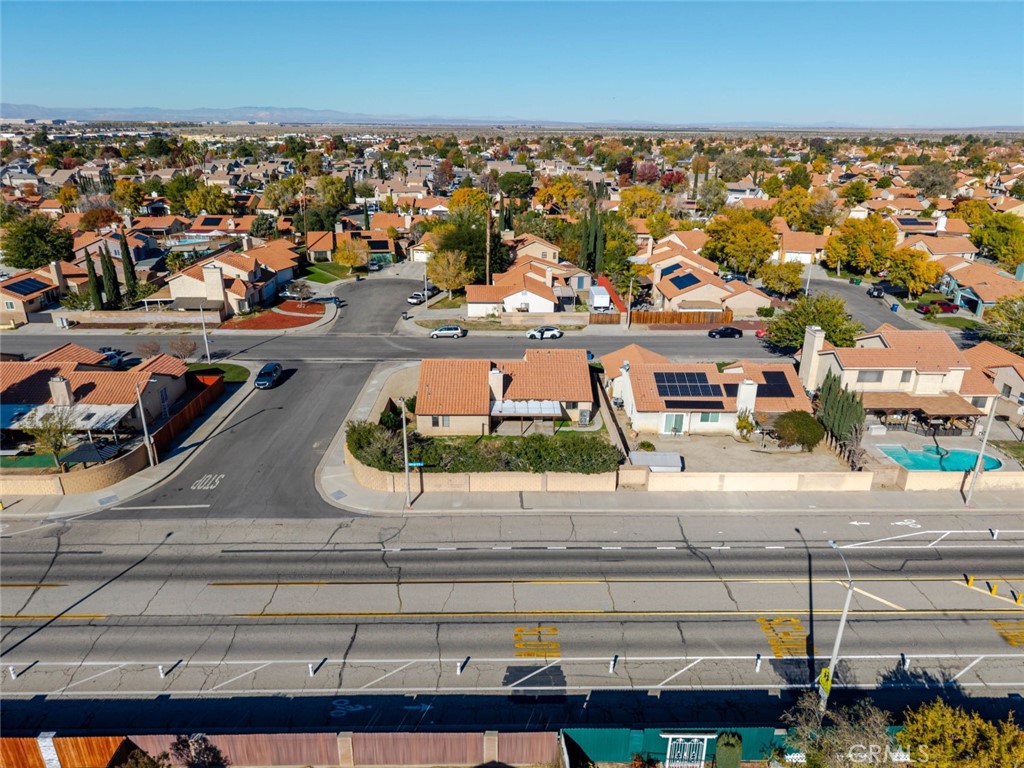 4906 Pacifica Avenue Palmdale, CA 93552 - Photo 34 of 36 an aerial view of a building with parking