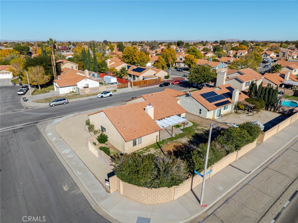 4906 Pacifica Avenue Palmdale, CA 93552 - Photo 35 of 36 an aerial view of a house with a yard and lake view