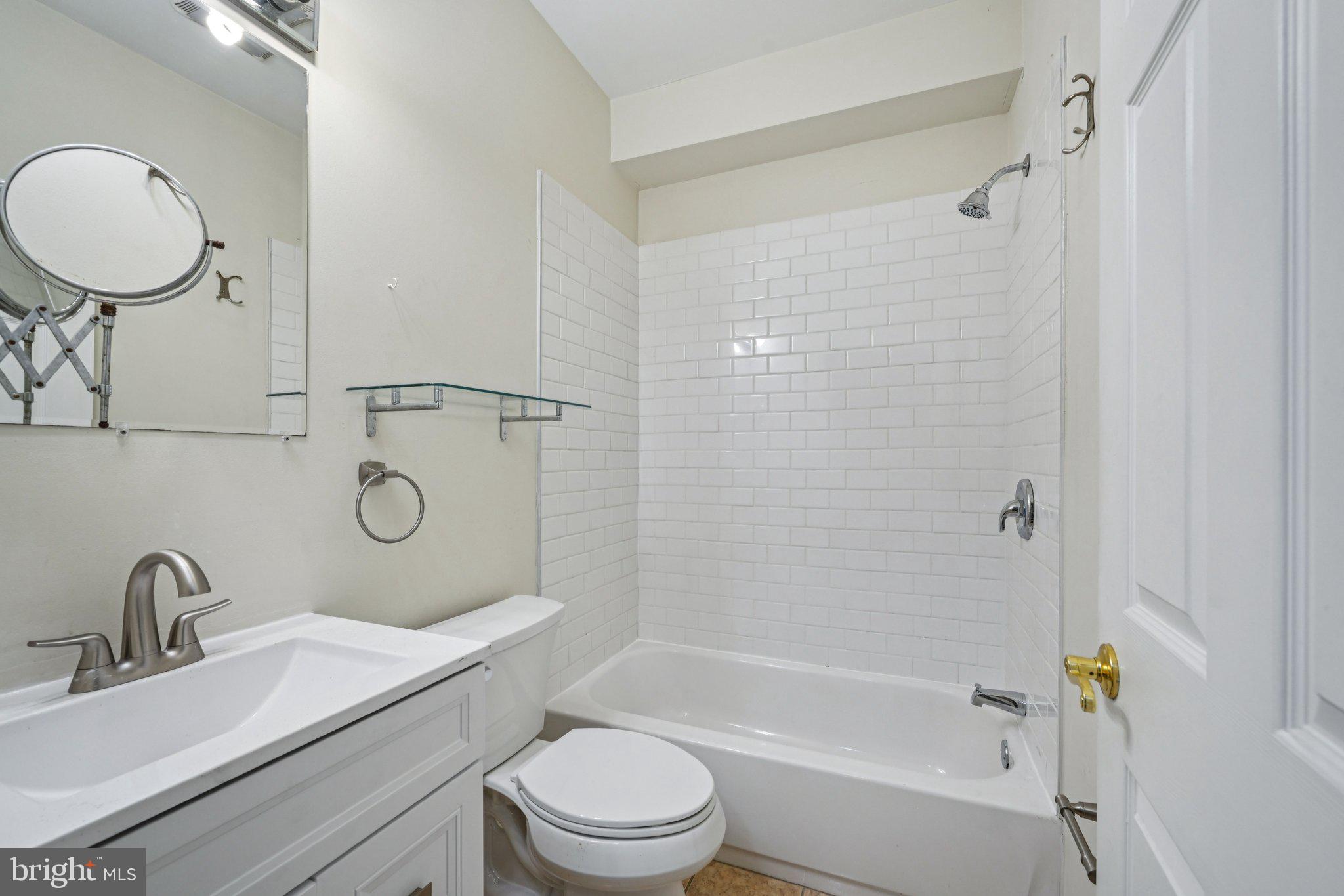 552 North 11th Street Philadelphia, PA 19123 - Photo 15 of 47 a bathroom with a granite countertop sink toilet and shower