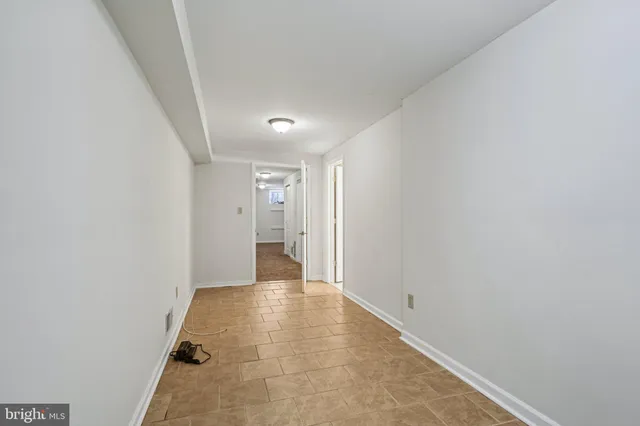 a living room with furniture a dining table and a fireplace
