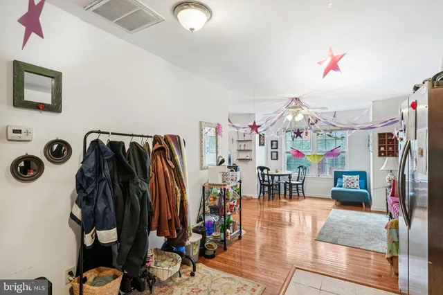 a view of a hallway with windows and stairs