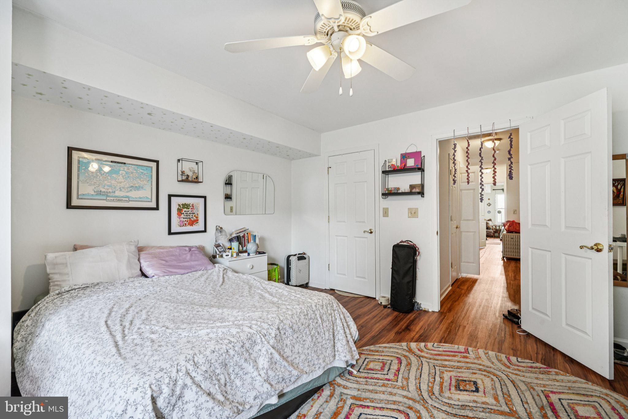 552 North 11th Street Philadelphia, PA 19123 - Photo 32 of 47 a bedroom with a bed and wooden floor