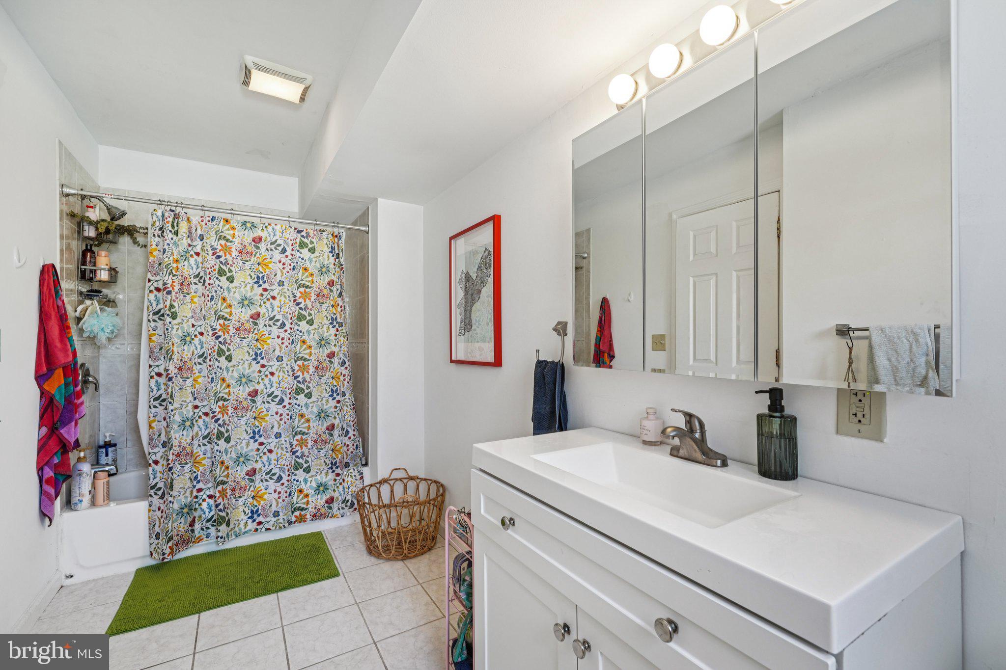 552 North 11th Street Philadelphia, PA 19123 - Photo 34 of 47 a bathroom with a sink and a mirror