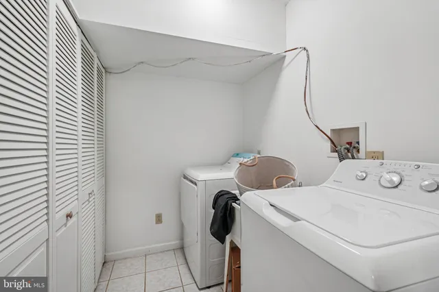 a view of a workspace with furniture and wooden floor