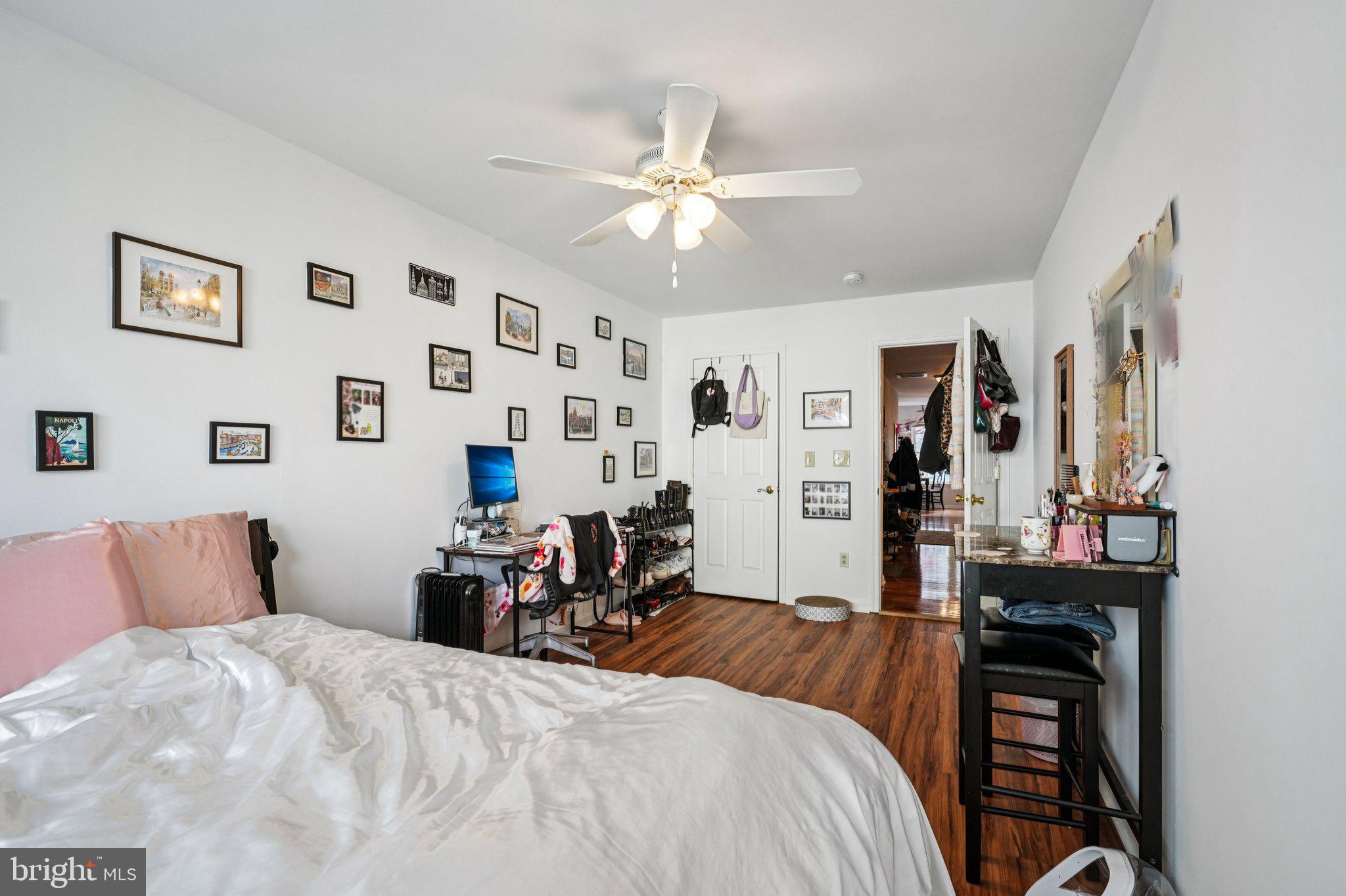 552 North 11th Street Philadelphia, PA 19123 - Photo 39 of 47 a bedroom with a bed and wooden floor