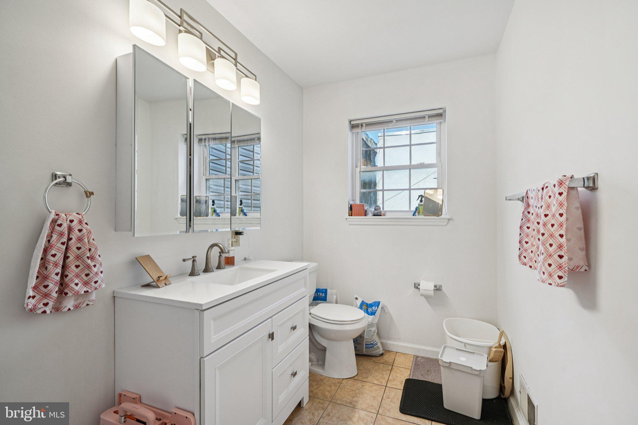 552 North 11th Street Philadelphia, PA 19123 - Photo 42 of 47 a bathroom with a toilet sink and mirror