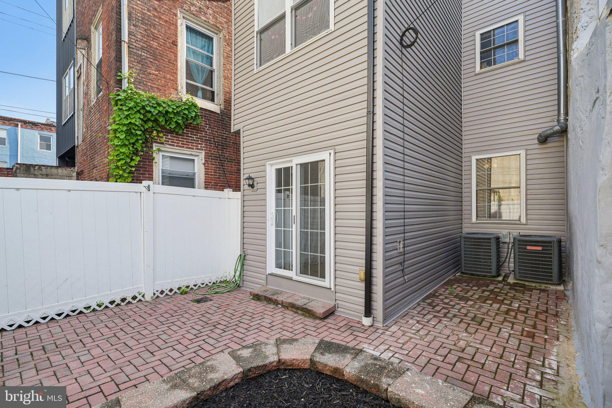 552 North 11th Street Philadelphia, PA 19123 - Photo 45 of 47 a view of a house with backyard and wooden fence