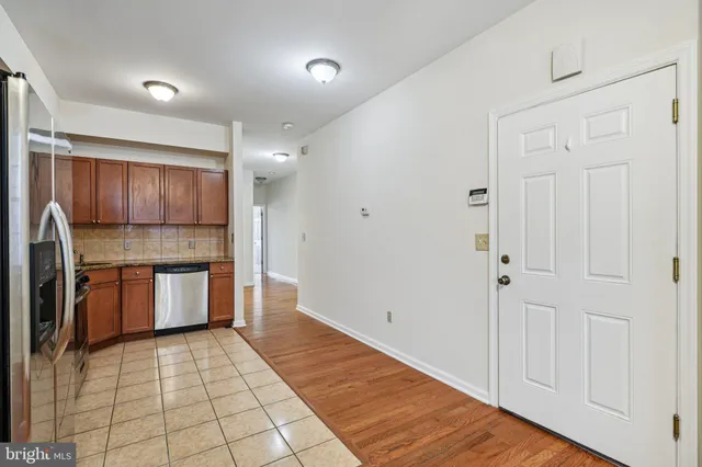 a view of a kitchen with wooden floor
