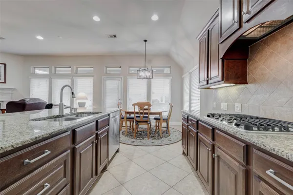 a kitchen with counter top space and cabinets