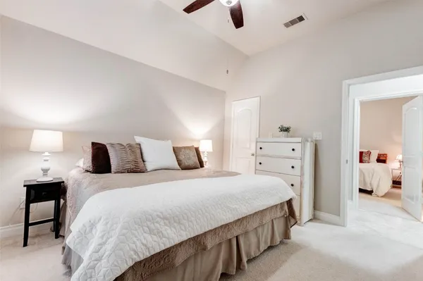 a bedroom with a bed and walk in closet
