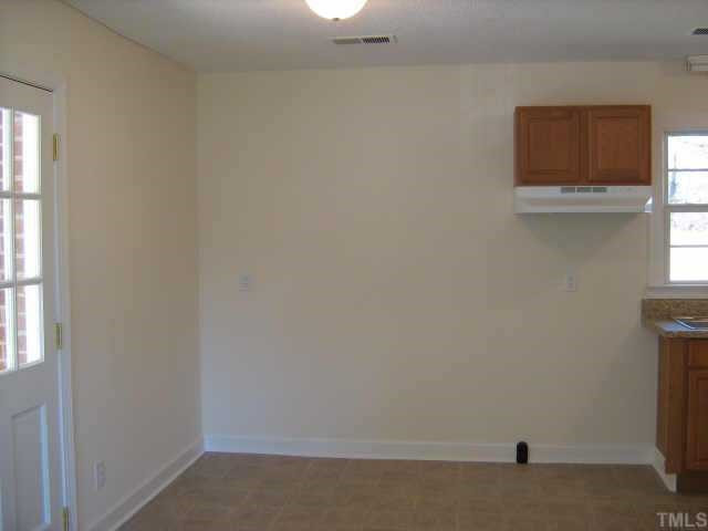 561 Clayton Road Durham, NC 27703 - Photo 4 of 9 a room with a window