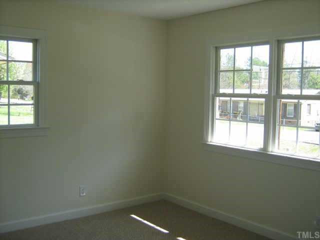 561 Clayton Road Durham, NC 27703 - Photo 7 of 9 an empty room with a window