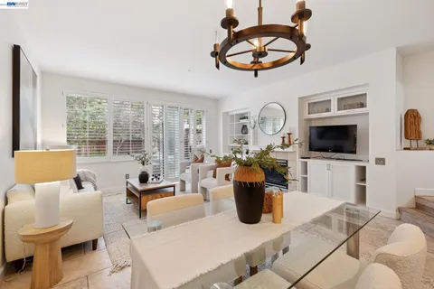 a view of a living room and dining room