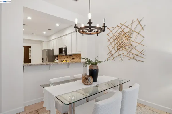 a kitchen with stainless steel appliances granite countertop a stove a refrigerator and a microwave
