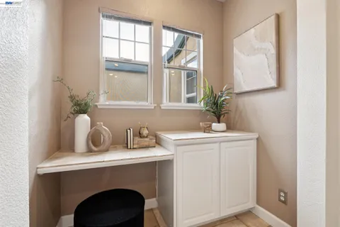 a bathroom with a double vanity sink toilet mirror and shower