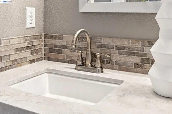 a bathroom with a bath tub and shower