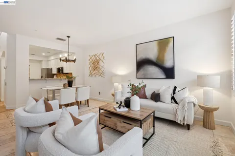 a living room with furniture and a lamp