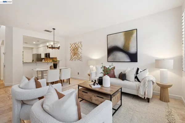 a living room with furniture and a lamp