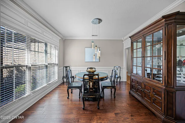 a dining room with furniture window wooden floor