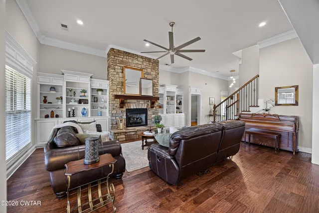 a living room with furniture and a fireplace