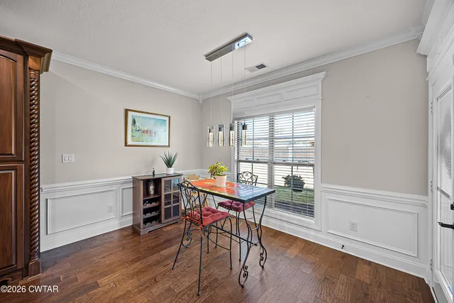 a workspace with furniture window and wooden floor