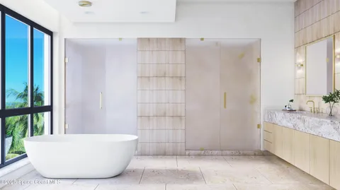a bathroom with a bathtub and shower