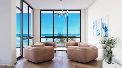 a view of a dining room with furniture a chandelier and wooden floor
