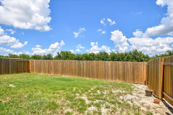 a house view with a backyard space