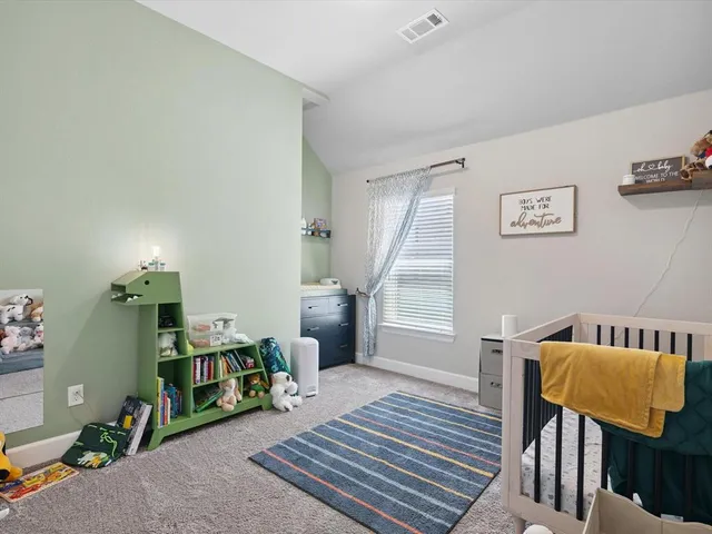 a view of a house with a yard and swimming pool
