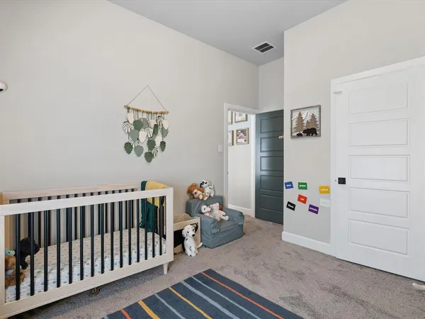 a bedroom with furniture and a book shelf