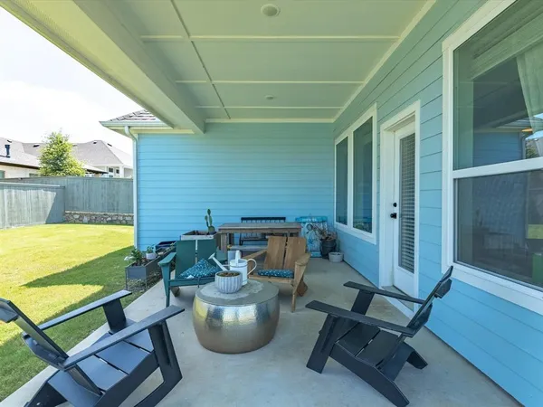 a bedroom with baby crib and a window