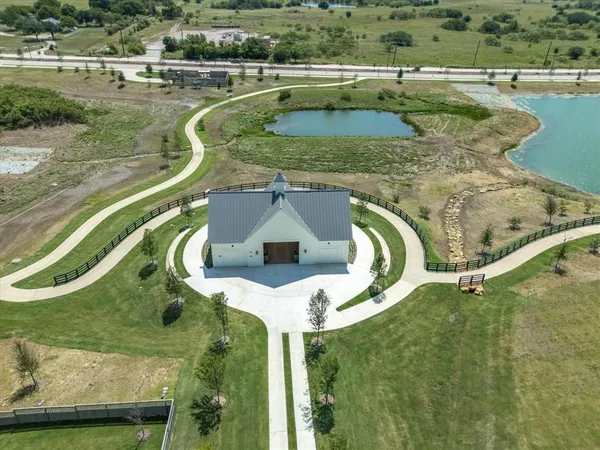 a view of a swimming pool with a yard
