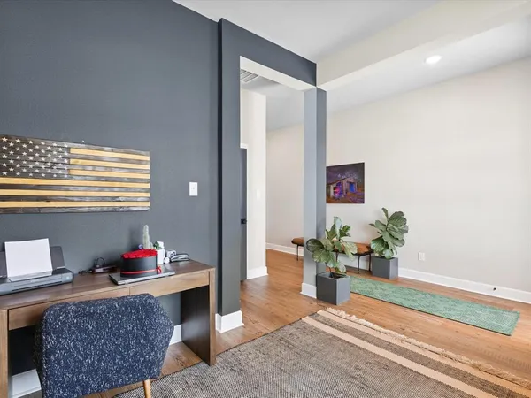 a living room with furniture and flowers