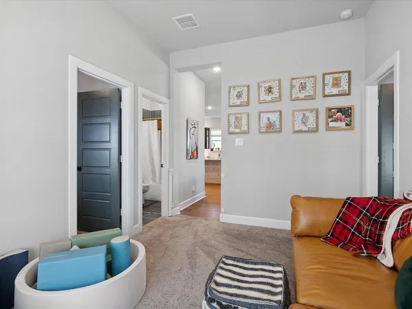 a living room with furniture and a bathtub