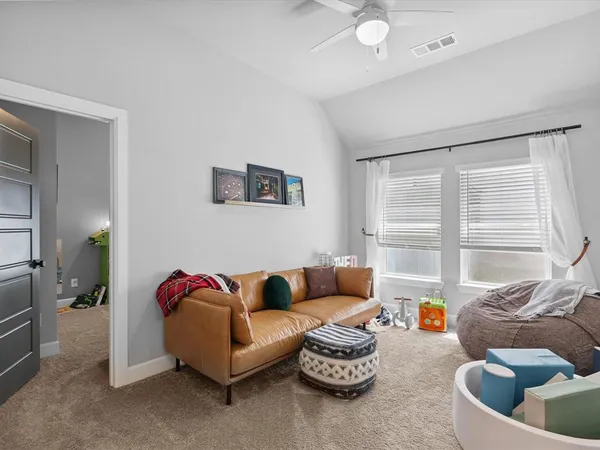 a living room with furniture and a window