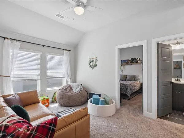a living room with furniture and a window